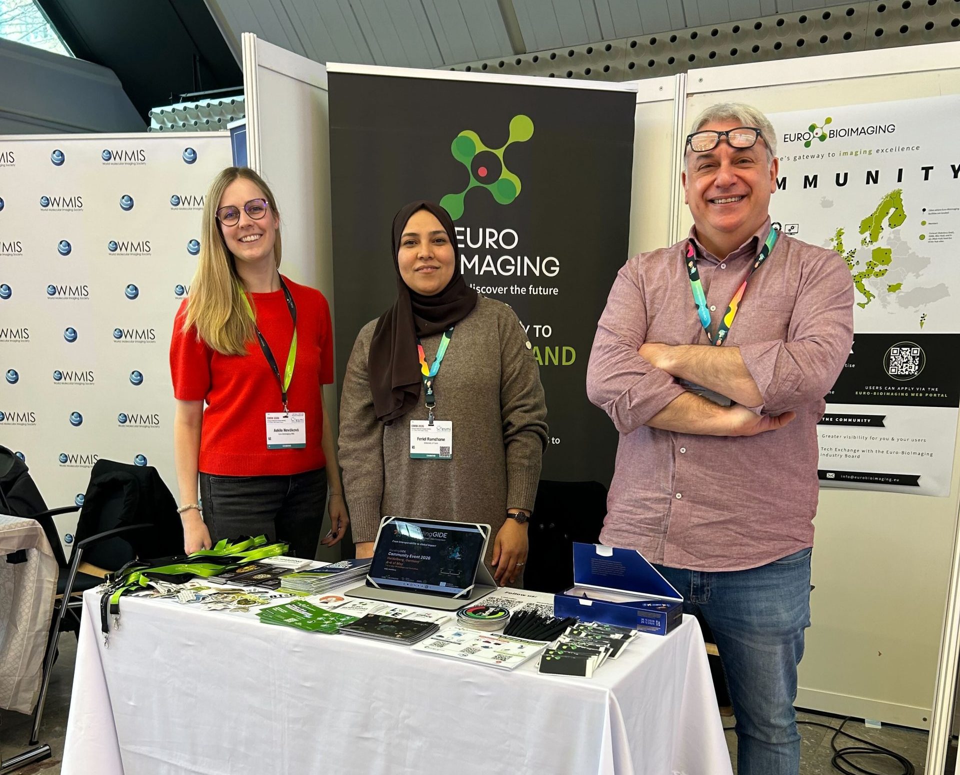 Three people at a booth