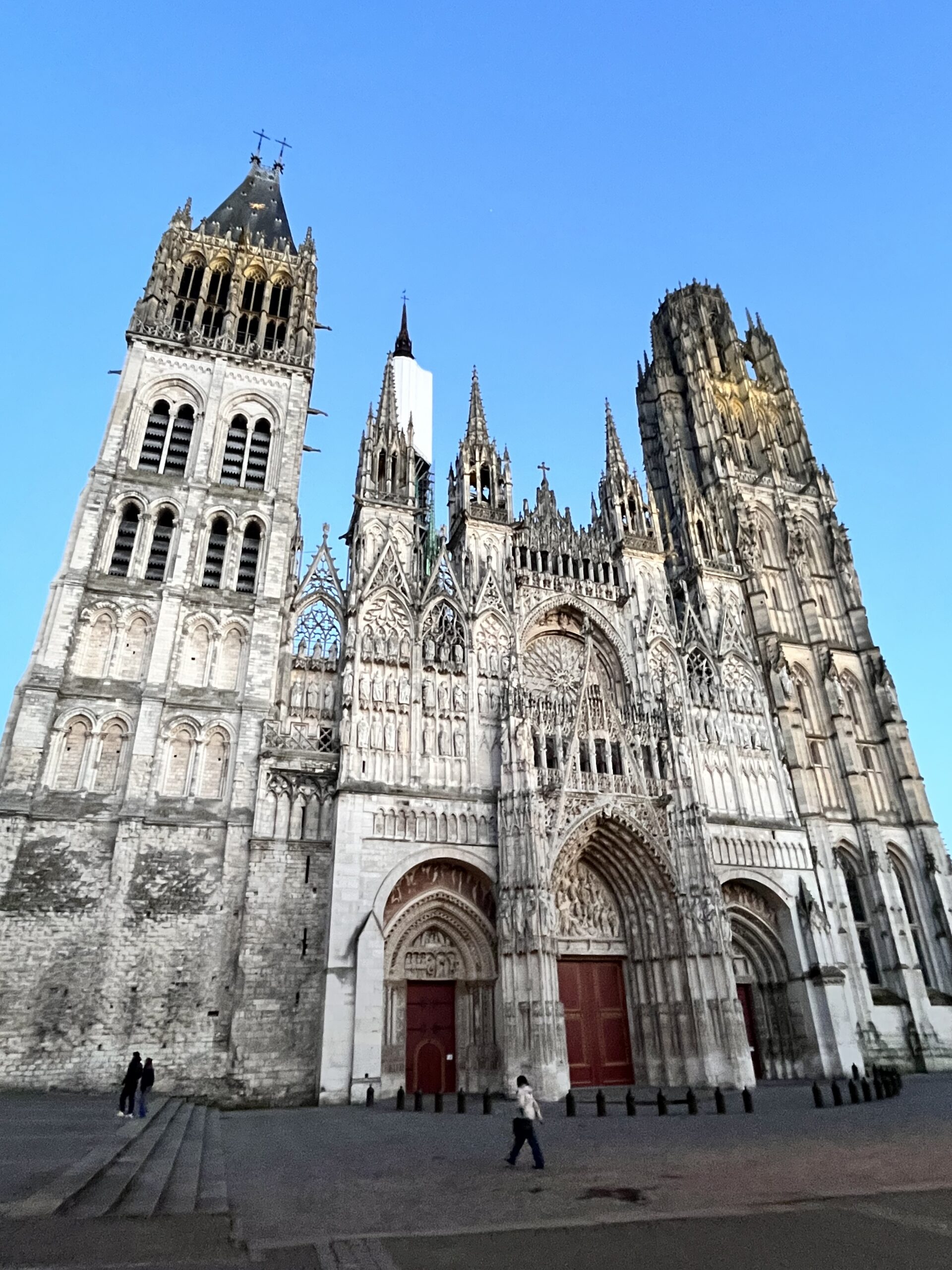 The front of Rouen cathedral in the evening.