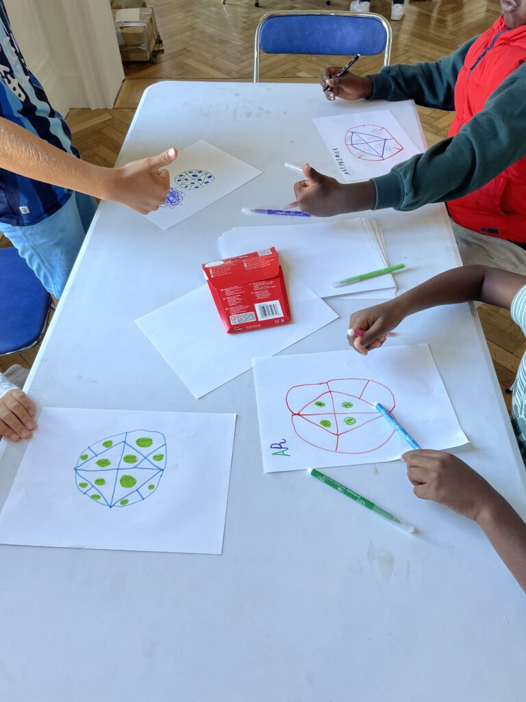 children participating in a workshop on microscopy