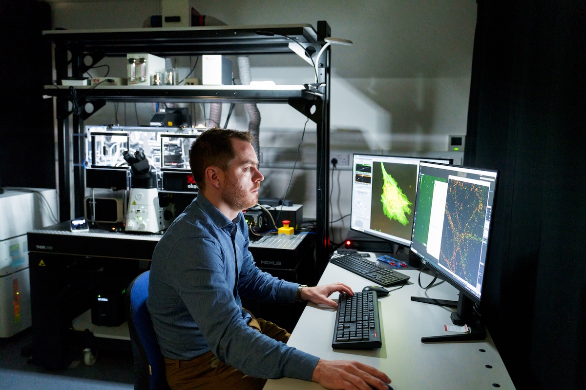 Man in front of a microscope