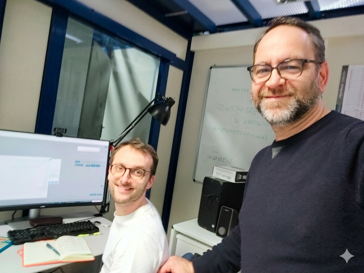 Two researchers in front of a computer