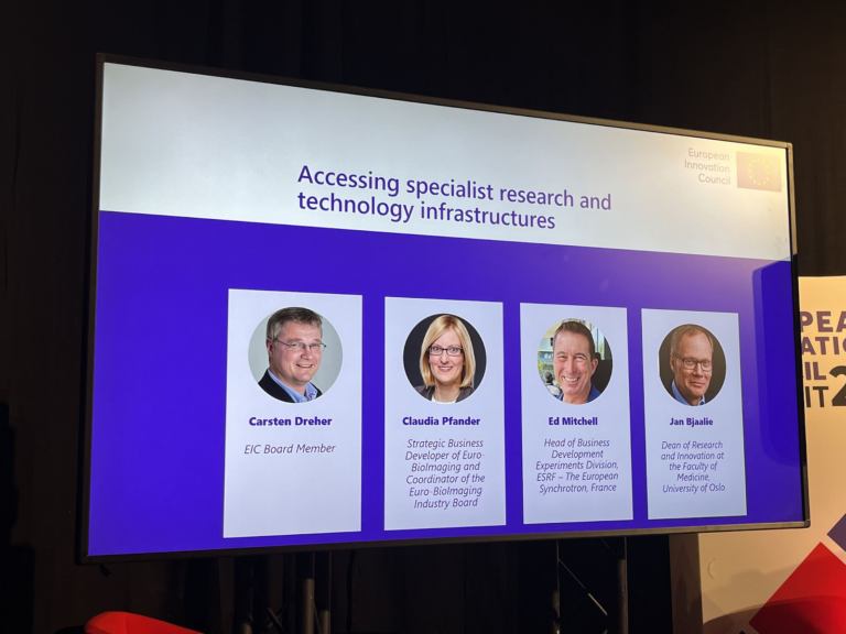 Screen at the EIC Summit announcing the panelists