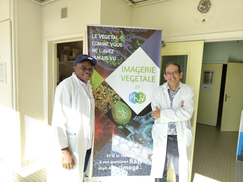 Two men in front of MRI-PHiV imaging platform at CIRAD in Montpellier.