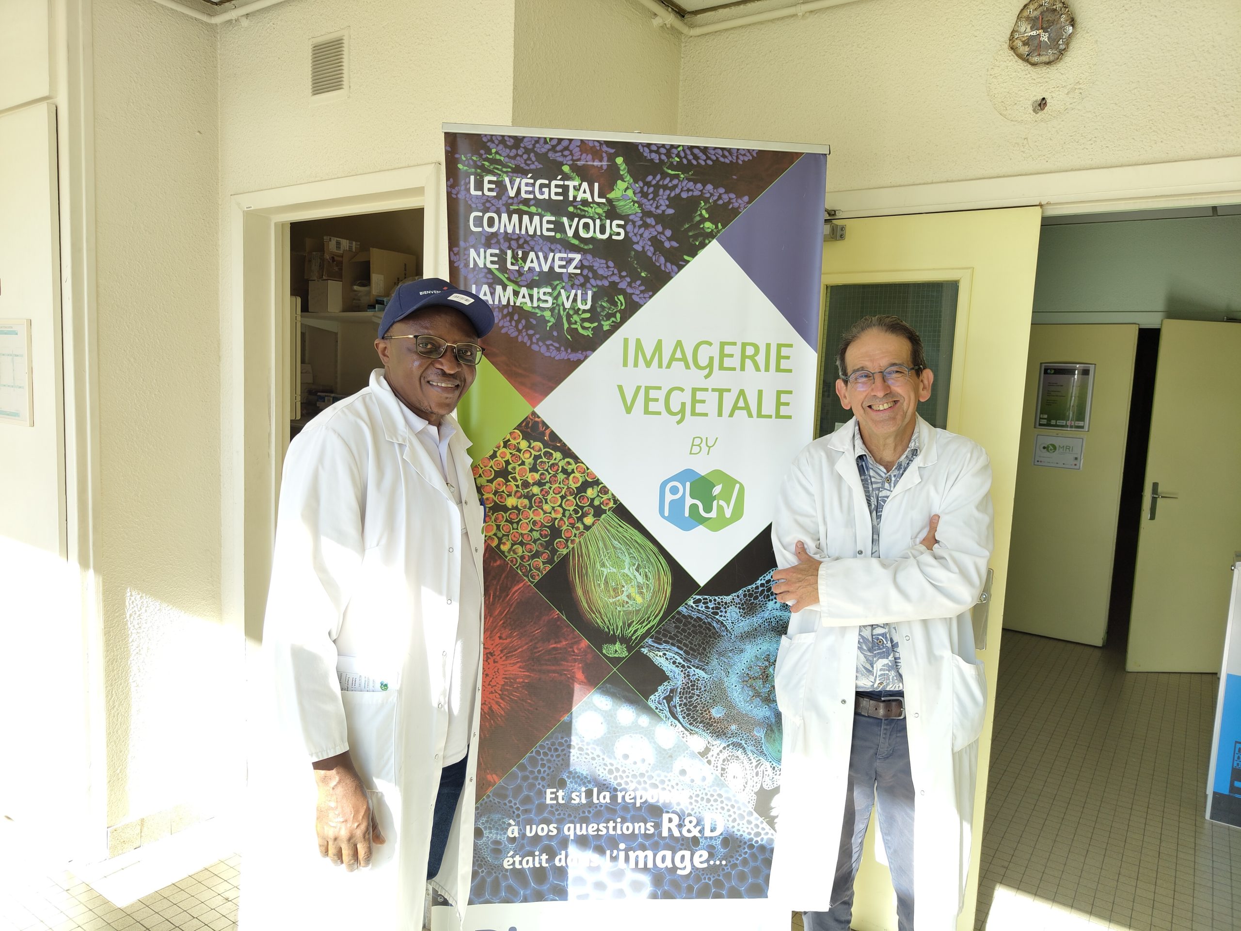 Two men in front of MRI-PHiV imaging platform at CIRAD in Montpellier.