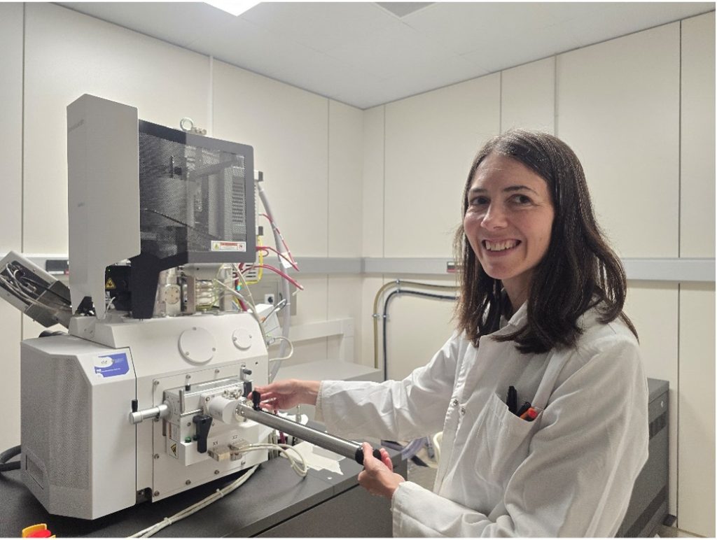 A woman being trained in Electron Microscopy.