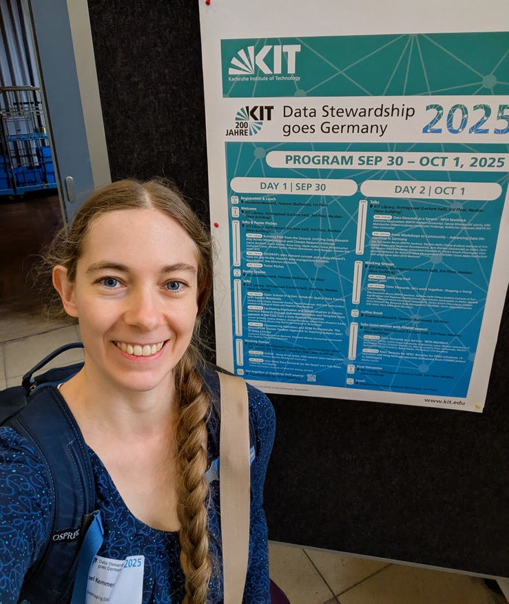 a woman standing in front of the agenda of the data stewardship goes germany conferece