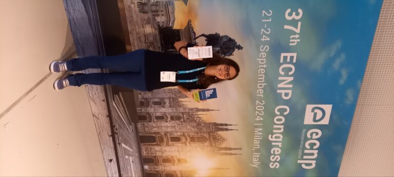 Alice Abbondanza at ECNP in Milan, with Euro-BioImaging brochures.