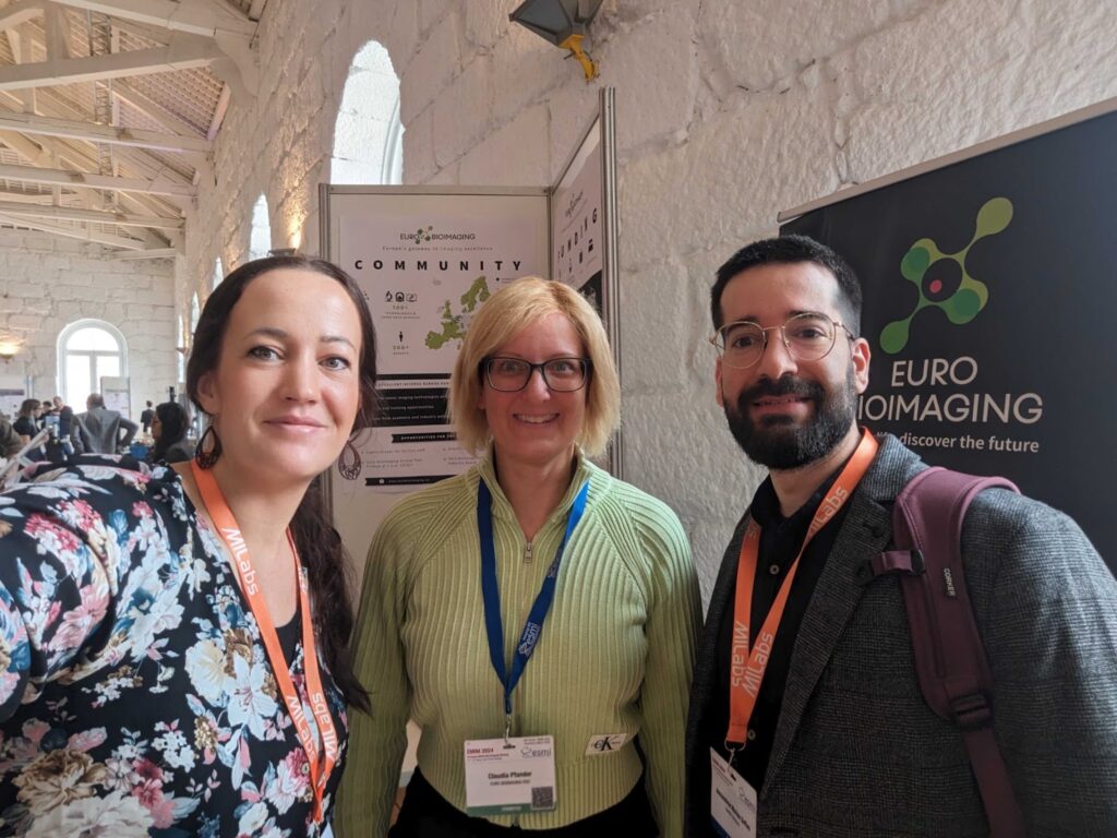 Alexandros at EMIM 2024 with Euro-BioImaging Hub team members.